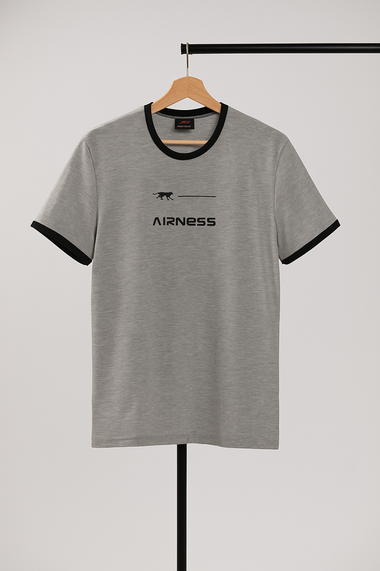 Gray t-shirt with black trim and logo on a hanger against a white background