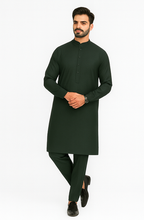 Man wearing a dark green kurta with black shoes on a white background