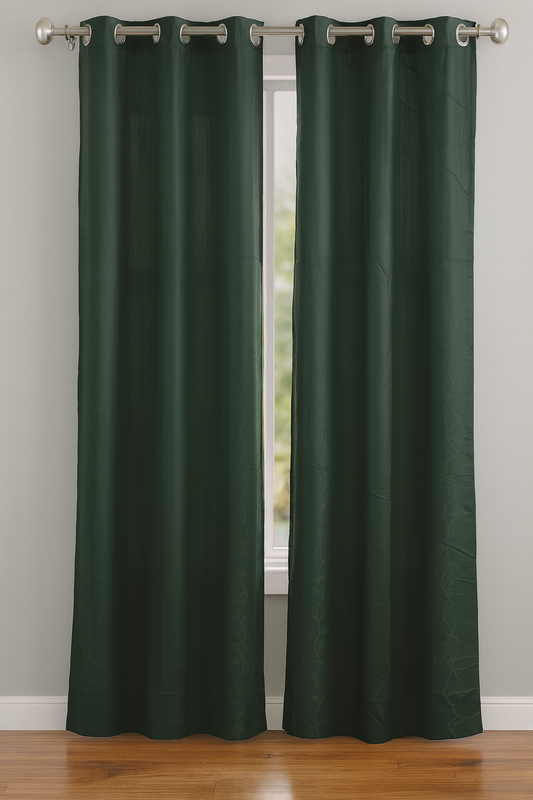 Pair of green curtains with grommets on a window.