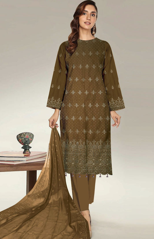 Woman wearing a green embroidered outfit with a matching dupatta on a neutral background