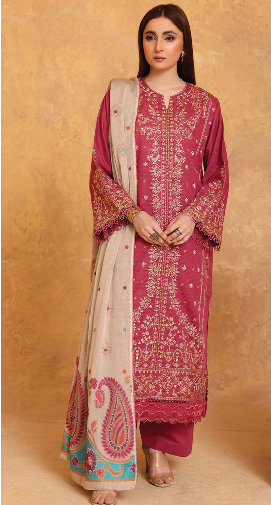 Woman wearing a pink embroidered traditional outfit with a beige dupatta on a beige background