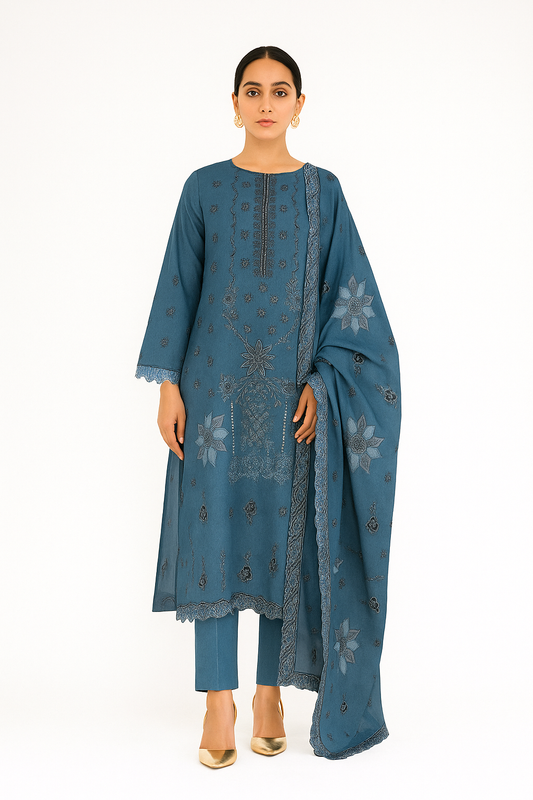 Woman wearing a blue embroidered outfit with a matching dupatta on a white background