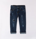 A pair of blue ripped jeans for boys by Sarabanda, with a straight fit and rolled-up hem.
