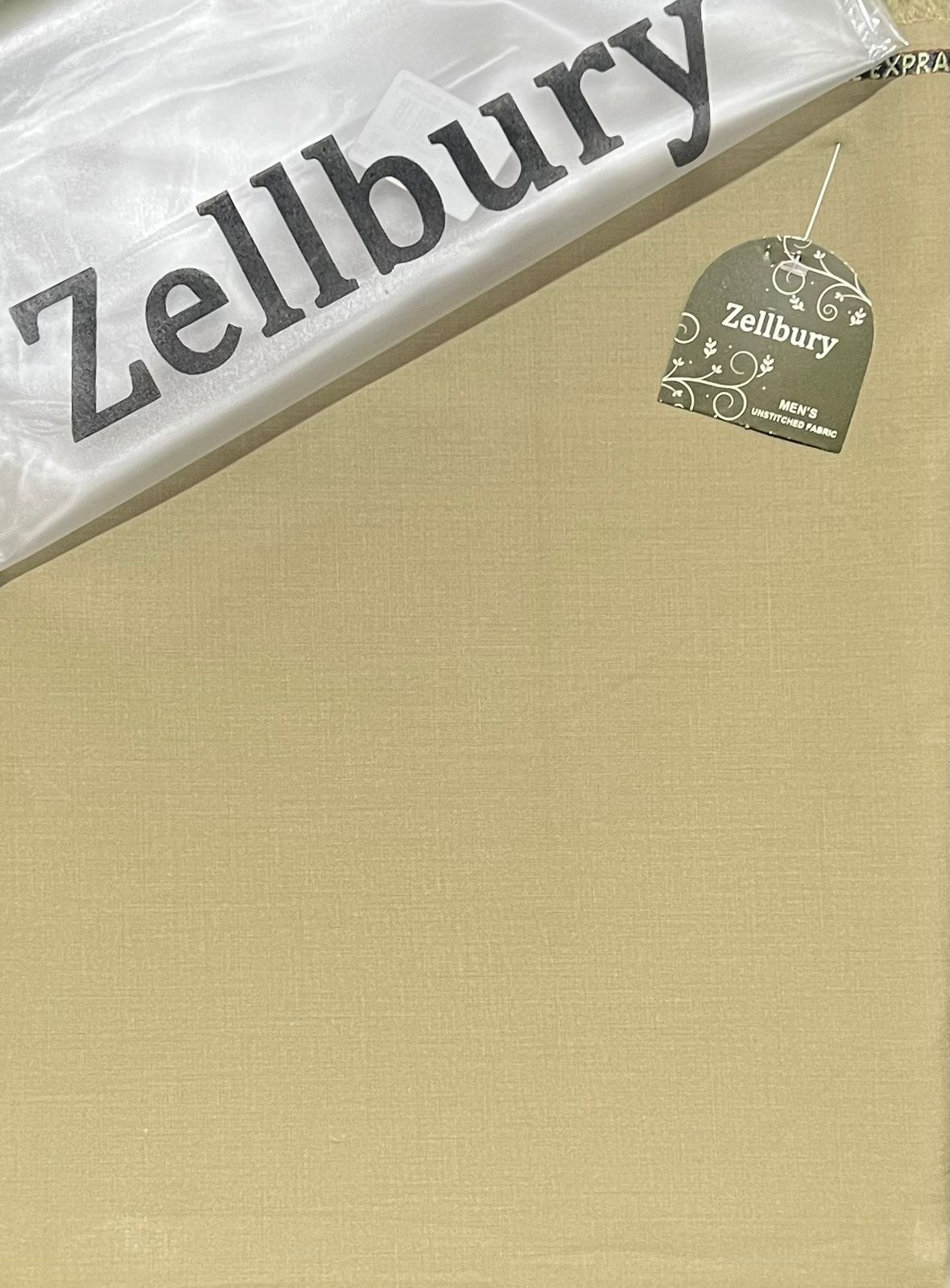 Beige fabric with Zellbury branding on a clear plastic bag