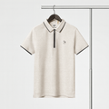 Beige polo shirt with black accents on a hanger against a white background