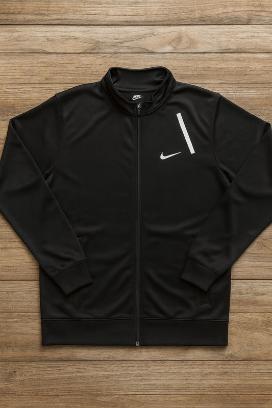 Black Nike jacket on a wooden surface