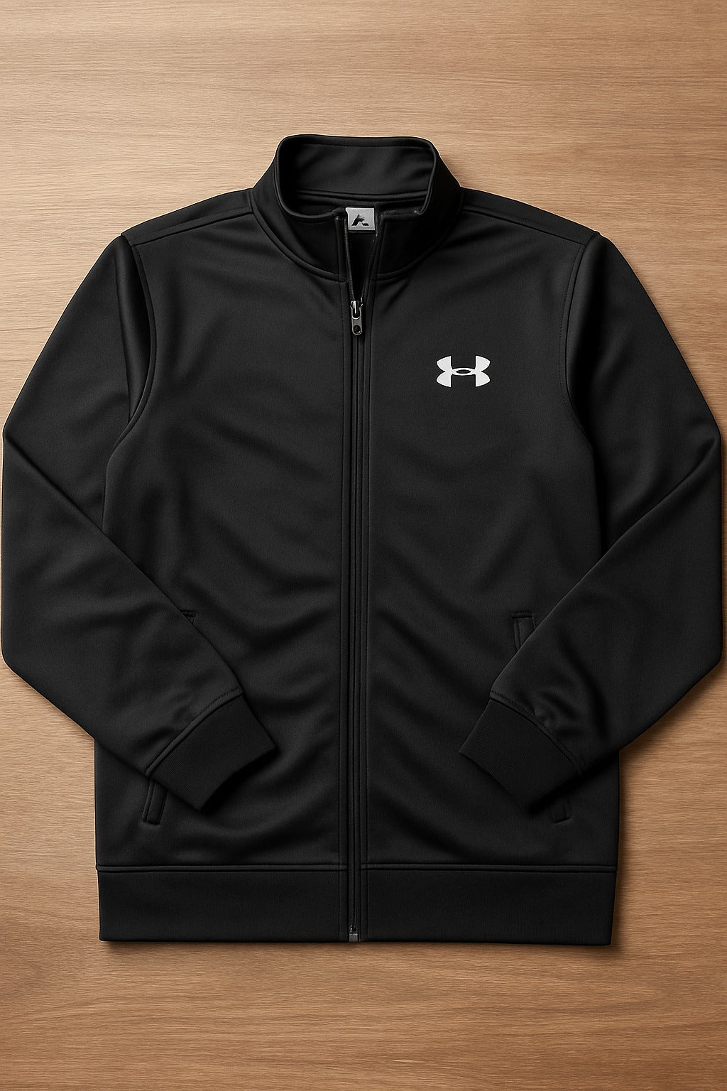 Black jacket with a logo on a wooden surface