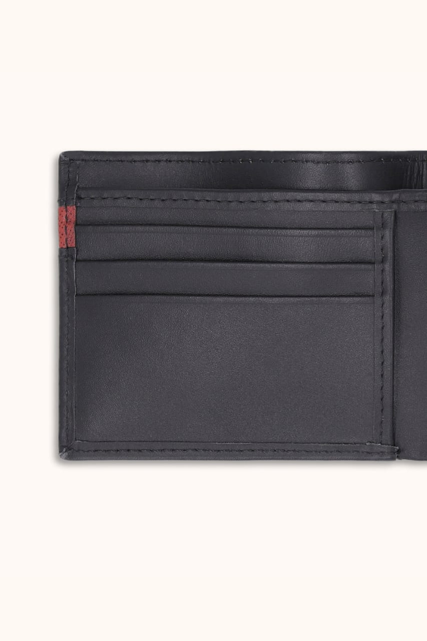 Black leather wallet with a red label on a white background