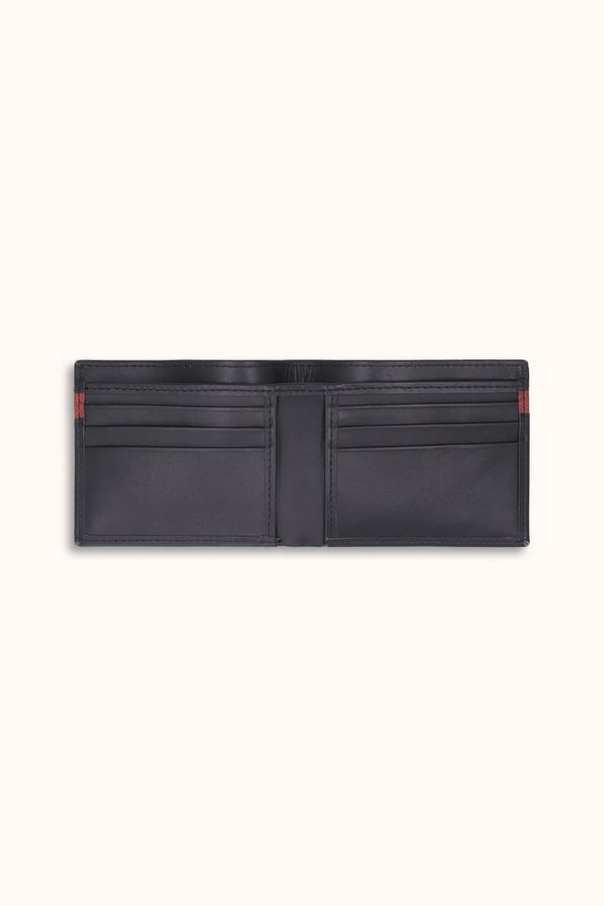 Black leather wallet with red accents on a white background
