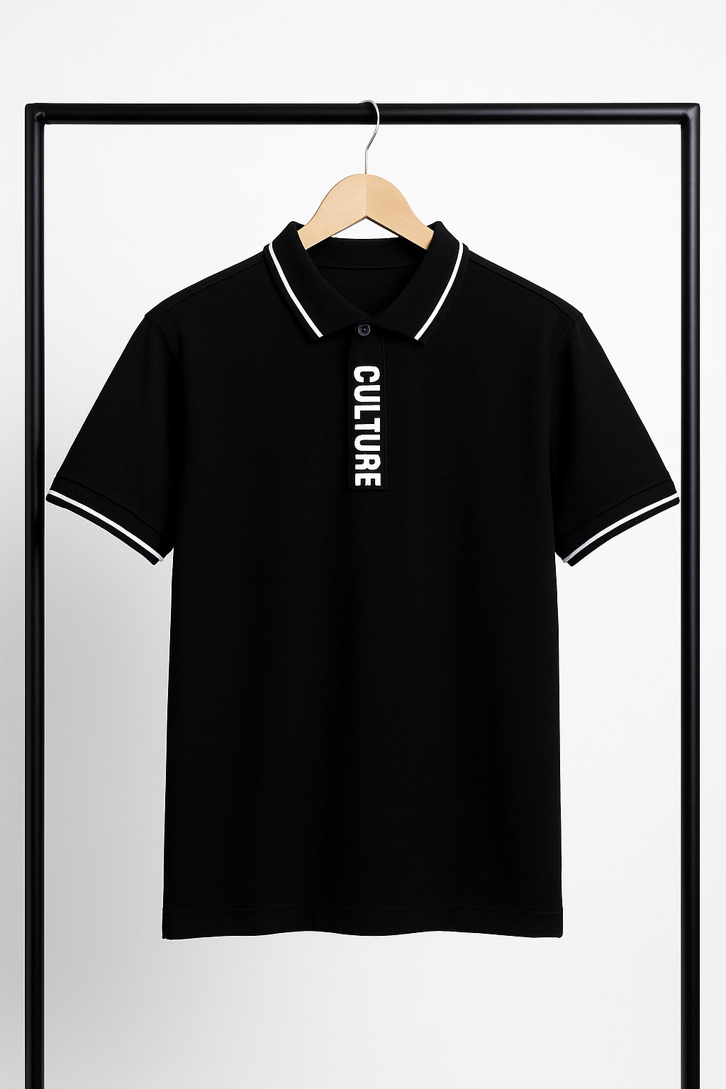 Black polo shirt with 'CULTURE' text on a hanger against a white background