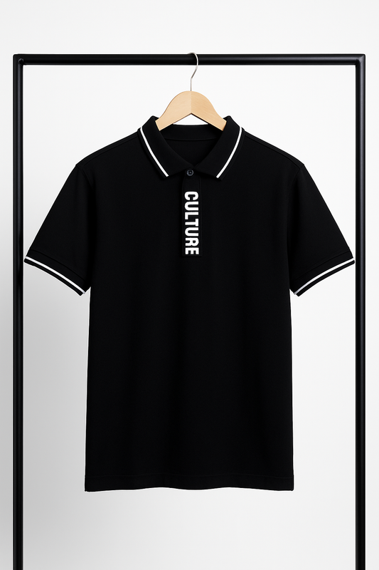 Black polo shirt with 'CULTURE' text on a hanger against a white background