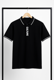 Black polo shirt with 'CULTURE' text on a hanger against a white background