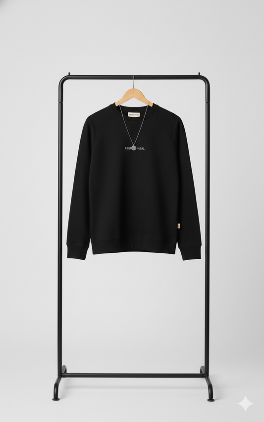 Black sweatshirt on a black rack against a white background