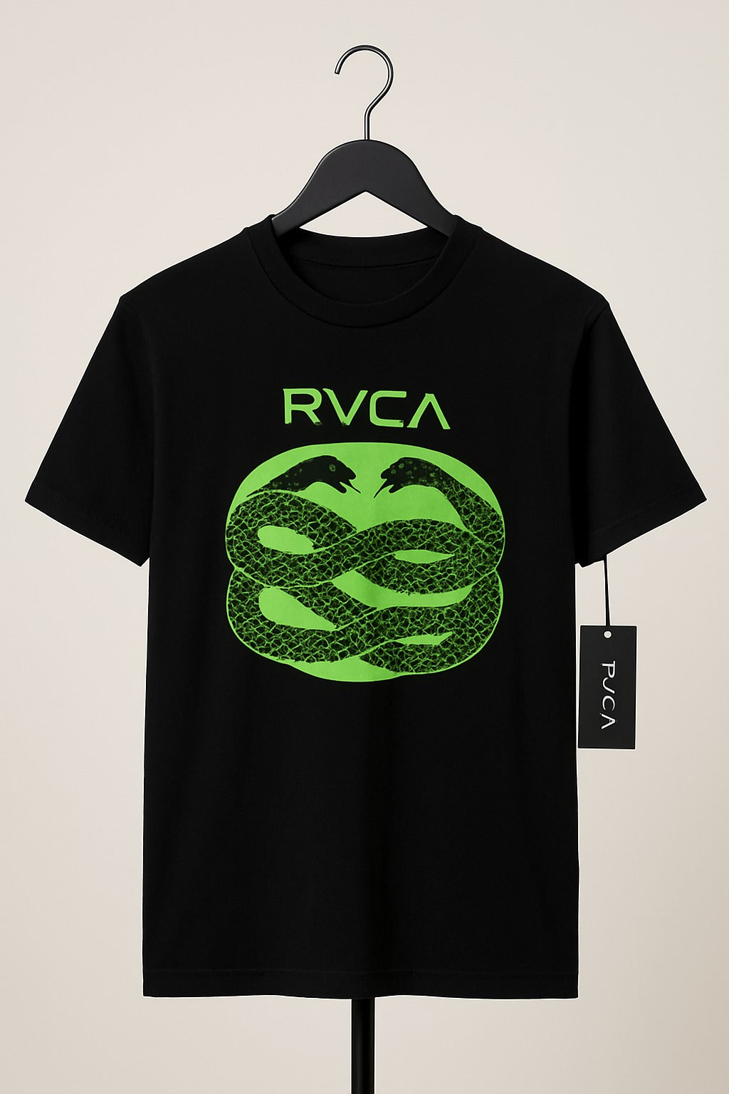 Black t-shirt with green RVCA logo on a hanger against a beige background