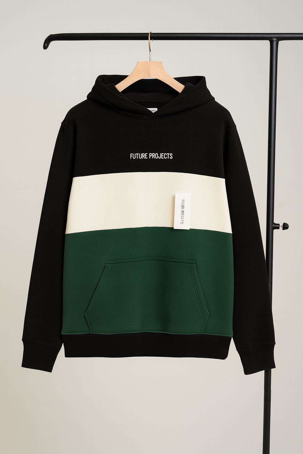 Black, white, and green hoodie with 'Future Projects' text on a hanger against a gray background
