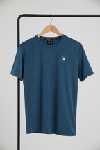 Blue t-shirt with a logo on a hanger against a white background