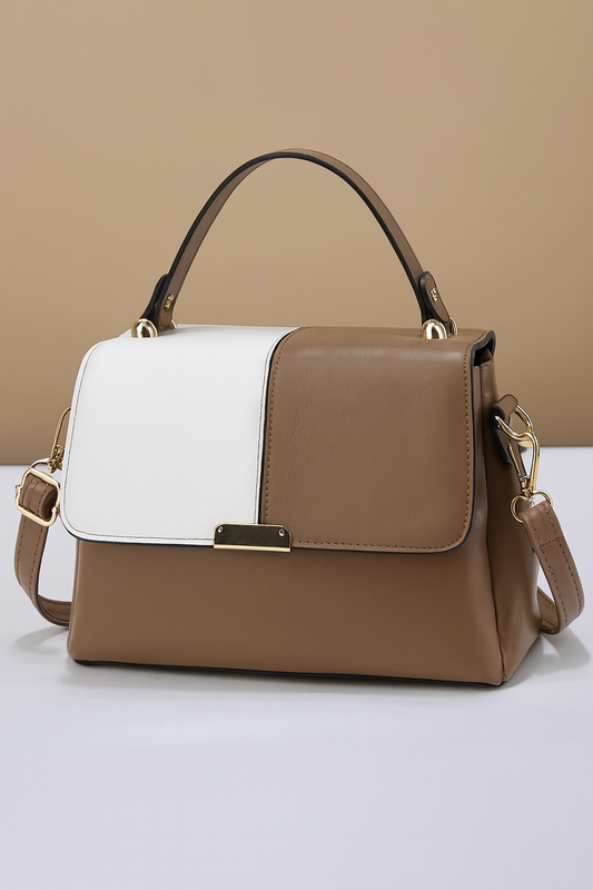 Brown and white handbag on a beige background