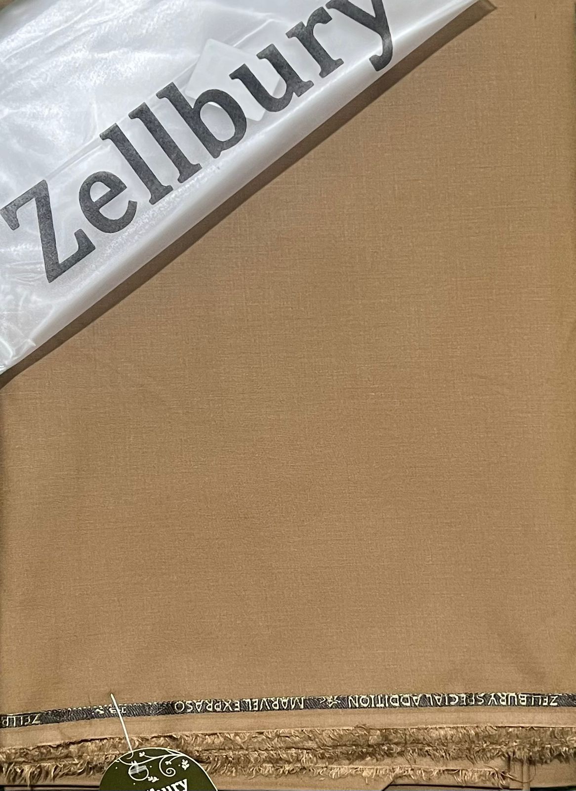 Brown fabric with Zellbury branding on a clear background