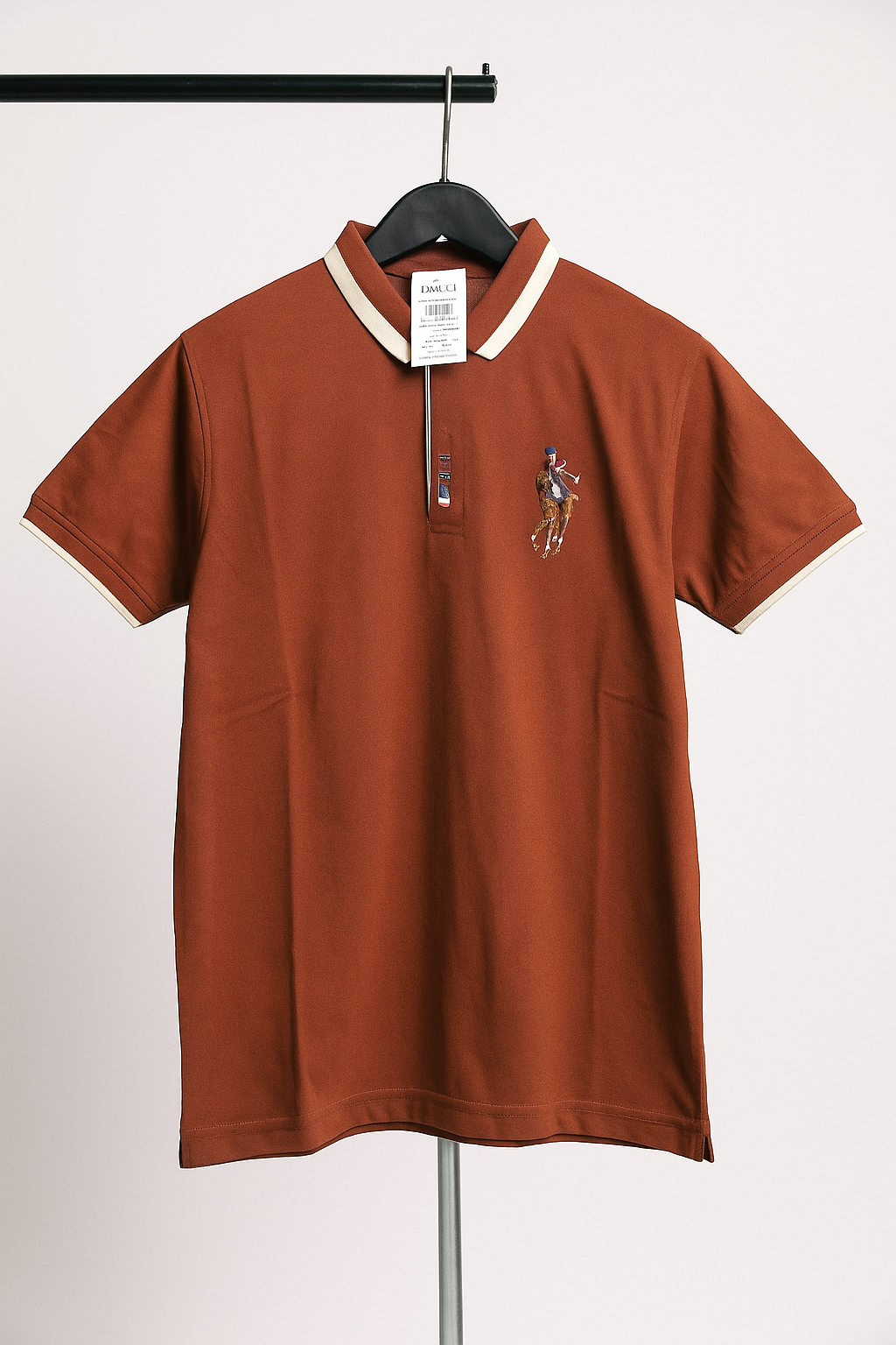 Brown polo shirt with a logo on a hanger against a white background