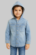 Child wearing a light blue denim jacket with a hood on a gray background