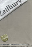 Close-up of a Zellbury product with a gold tag on a gray background