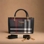 Designer handbag with plaid pattern and matching leash on a beige background
