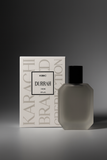 Kibic Durrah perfume bottle and packaging on a gray background