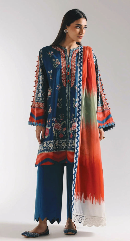 Woman wearing a colorful traditional outfit with a matching dupatta on a white background