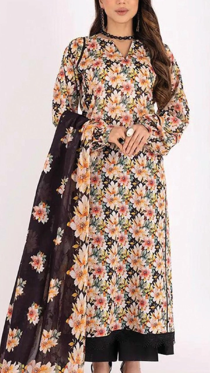 Floral dress with a black dupatta on a white background