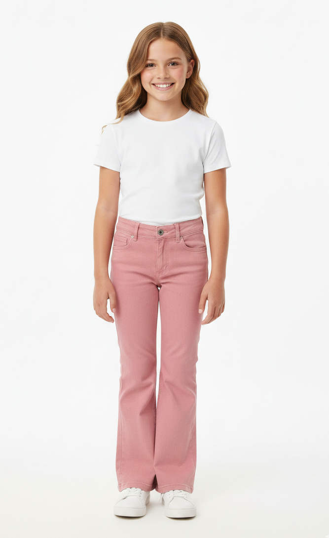 Young girl wearing a white t-shirt and pink jeans on a white background