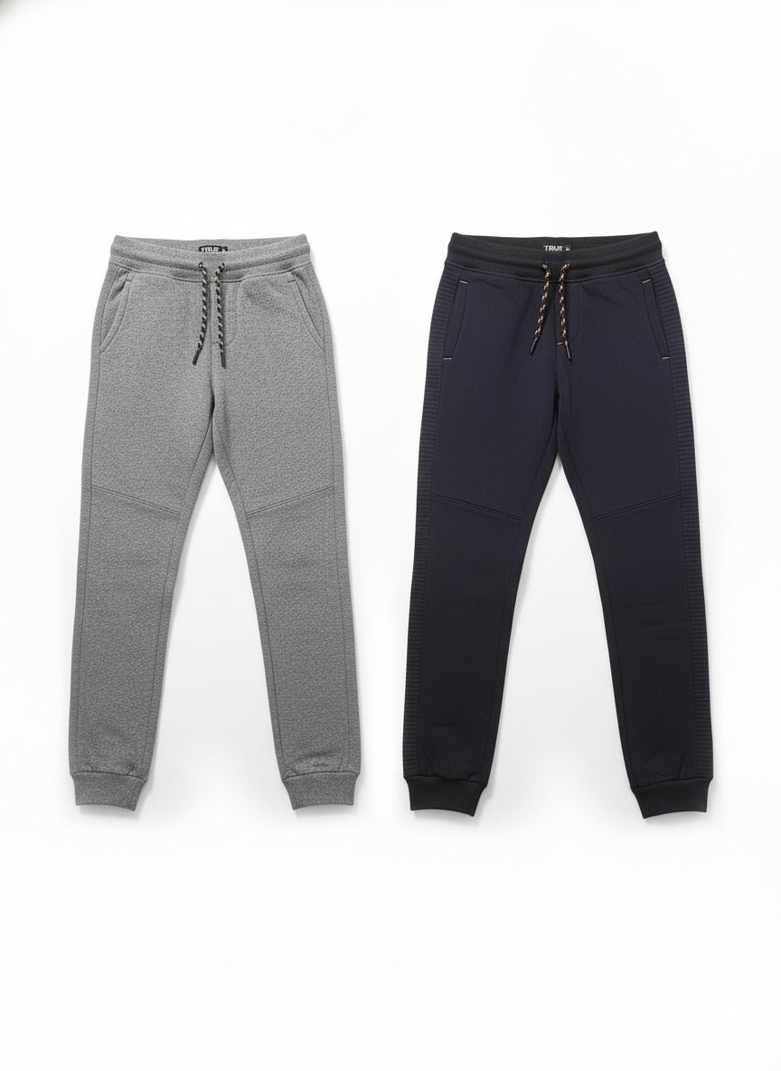 Gray and black jogger pants on a white background