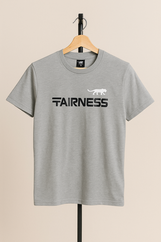 Gray t-shirt with 'AIRNESS' text on a hanger against a beige background