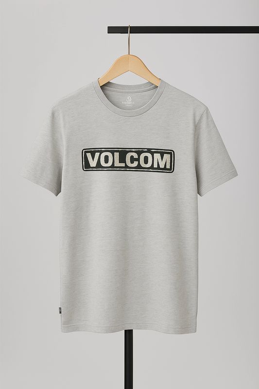 Gray t-shirt with Volcom logo on a hanger against a gray background