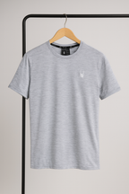 Gray t-shirt with a small spider logo on a hanger against a plain background