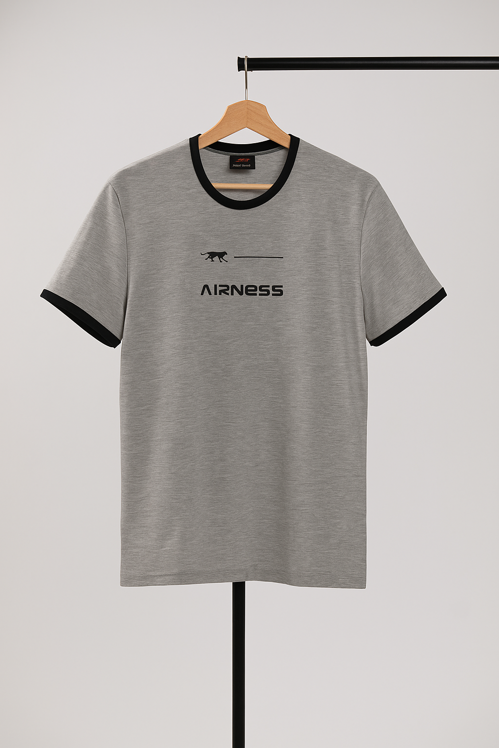 Gray t-shirt with black trim and logo on a hanger against a white background