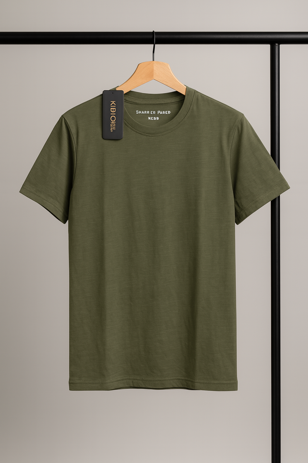Green t-shirt on a hanger against a neutral background