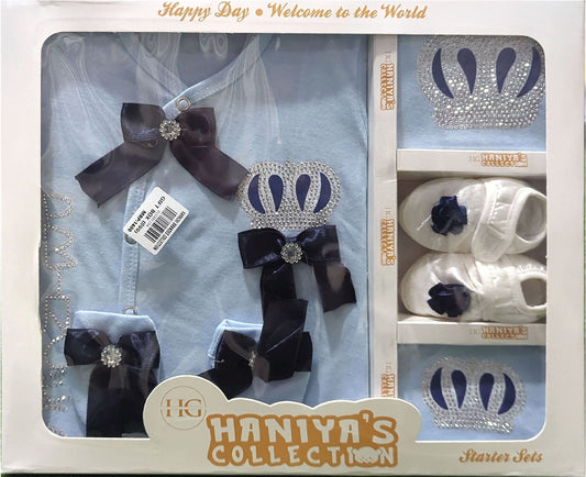 Haniya's Collection baby accessories set in packaging with bows, shoes, and a crown.