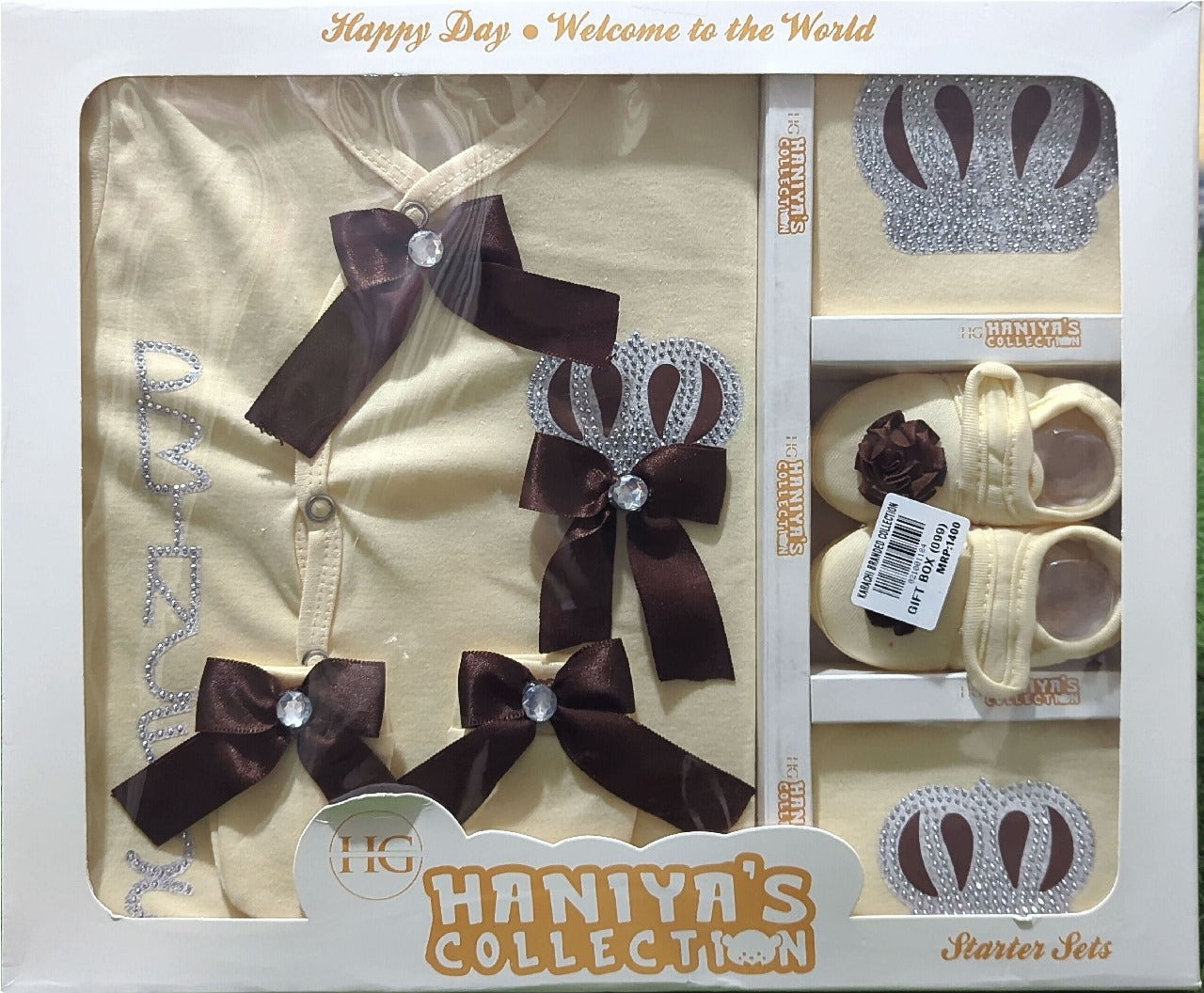 Haniya's Collection baby outfit set in packaging with shoes, headbands, and a crown.