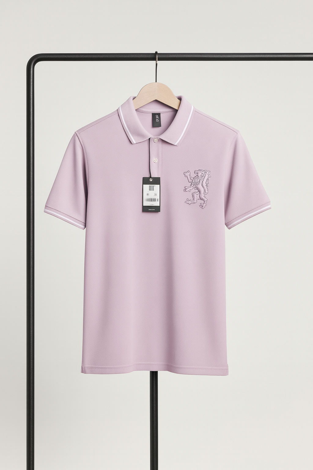 Light purple polo shirt with a brand logo on a hanger against a white background