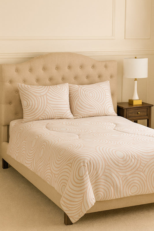 Lite Pink bedroom with a bed featuring patterned bedding and pillows.