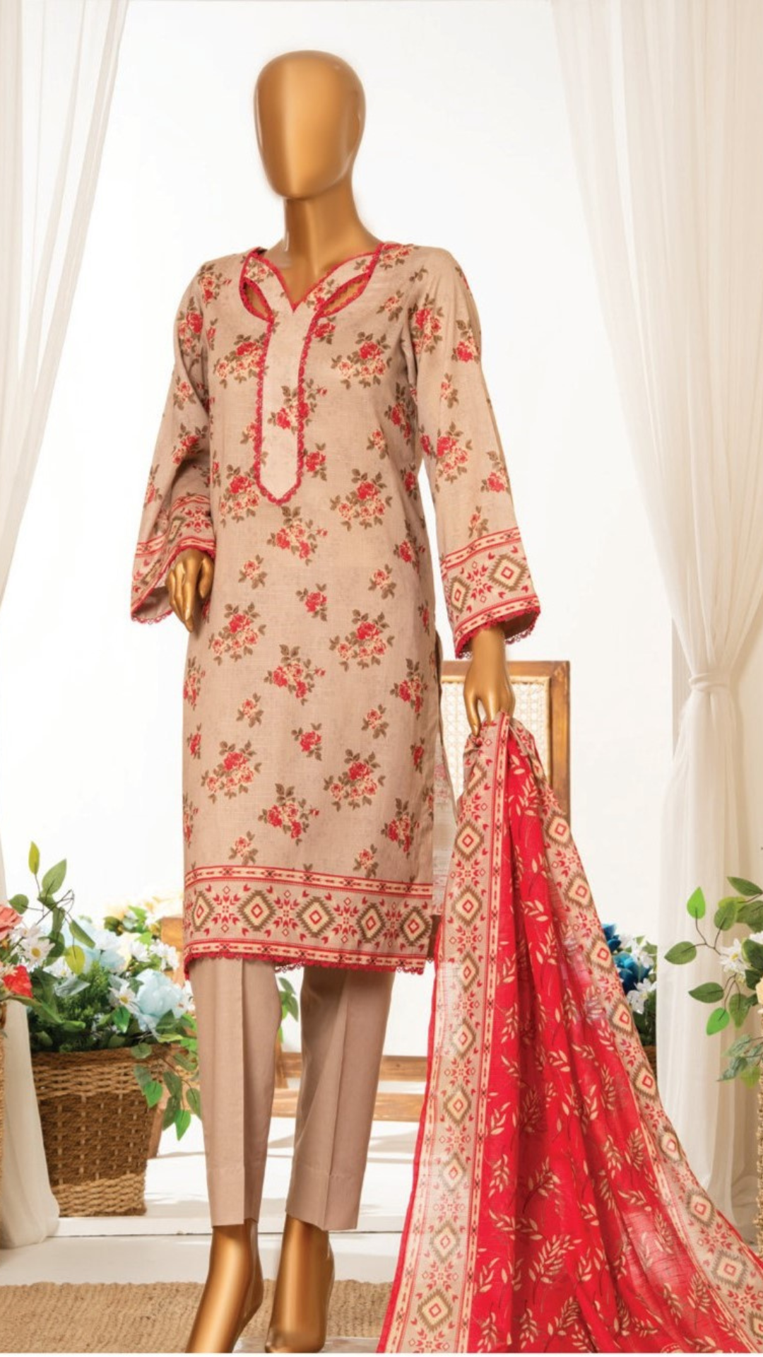 MTJ  Beige and red floral dress on a mannequin with a matching dupatta in a bright room.