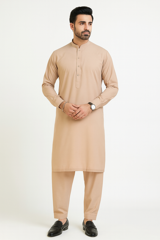 Man wearing a beige kurta with pants on a white background