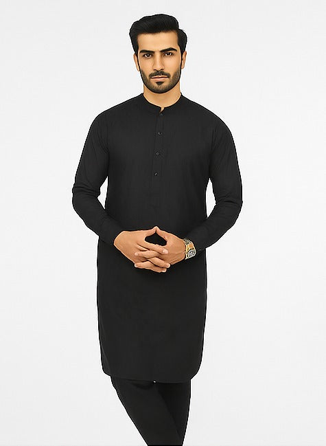 Man wearing a black kurta against a white background