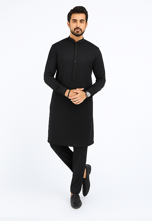 Man wearing a black kurta with black pants on a white background