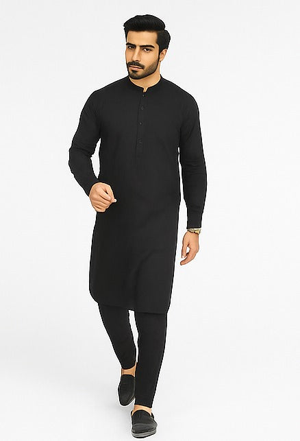 Man wearing a black kurta with black trouser on a white background
