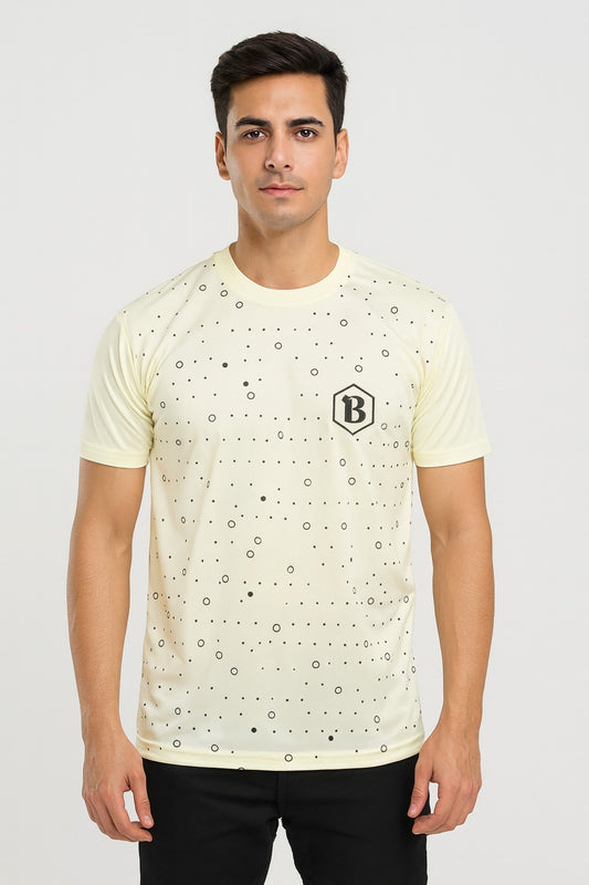 Man wearing a light-colored t-shirt with a geometric pattern and brand logo on a plain background