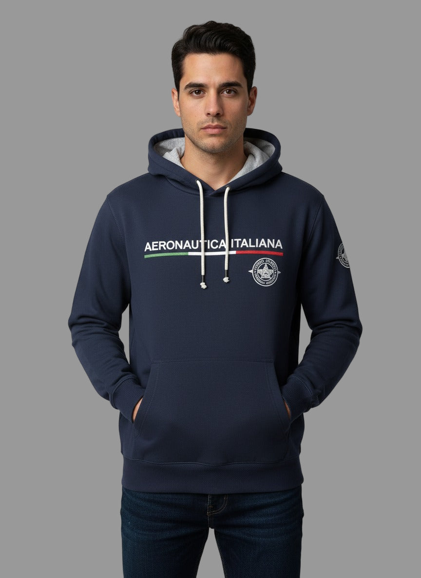 Man wearing a navy hoodie with 'Aeronautica Italiana' logo on a gray background