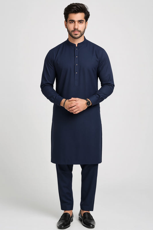 Man wearing a navy kurta with trouser on a white background