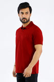 Man wearing a red polo shirt against a white background