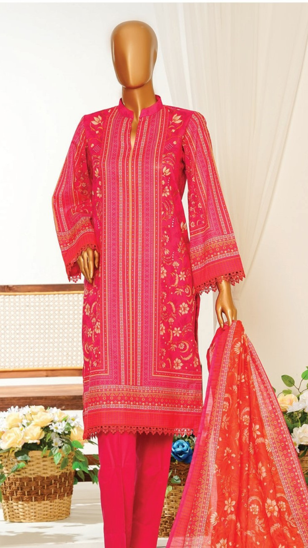 Mannequin MTJ wearing a bright pink printed outfit with a matching dupatta on a light background.